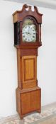 A 19th century oak longcase clock, the hood with a broken swan neck pediment and turned columns,