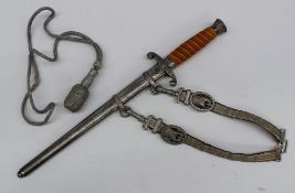 A World War II German Army Dagger,, with an orange celluloid handle, a crown shaped pommel,