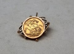 A George V gold sovereign dated 1914, in a yellow metal slip mount marked 9ct,