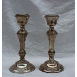 A pair of Elizabeth II silver candlesticks, with a tapering stem on a spreading foot, Birmingham,