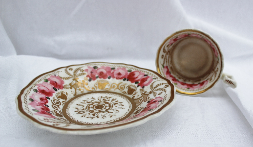 A Coalport porcelain cup and saucer, painted with bands of pink roses to a floral gilt border - Image 2 of 4