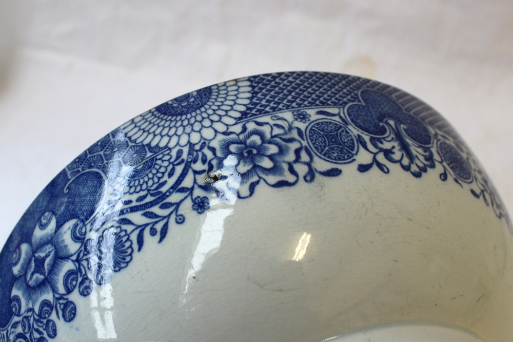 A 19th century blue and white pottery bowl, transfer decorated to the centre with two swans and - Image 5 of 5