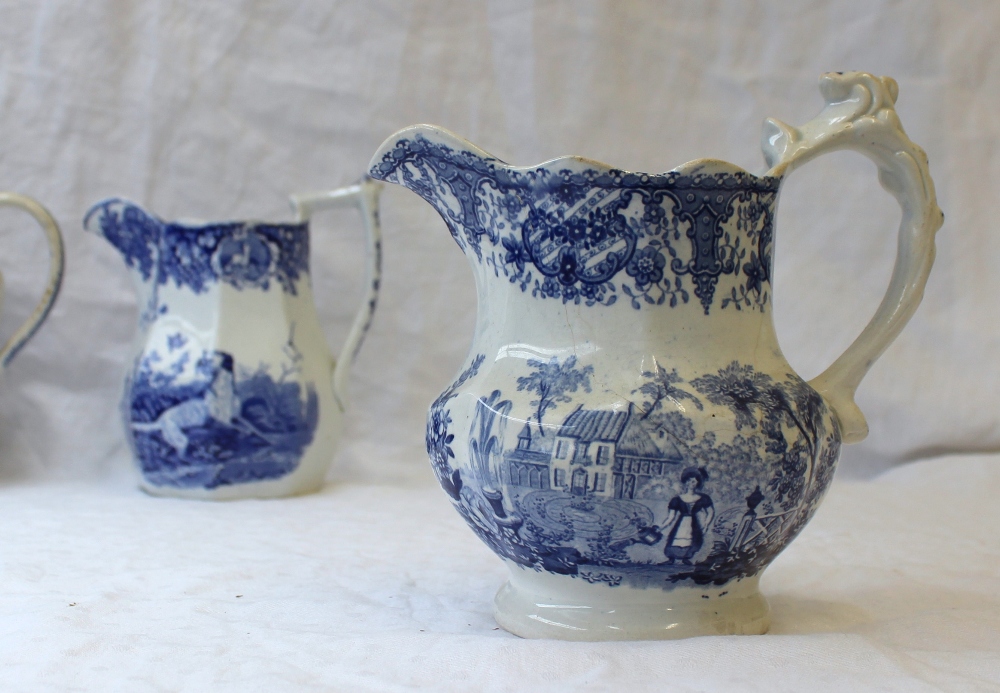 A 19th century pottery jug with blue and white transfer decoration of a setter with a game bird in - Image 7 of 9