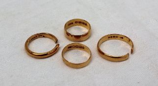 Four 22ct yellow gold wedding bands, two cut, approximately 15.