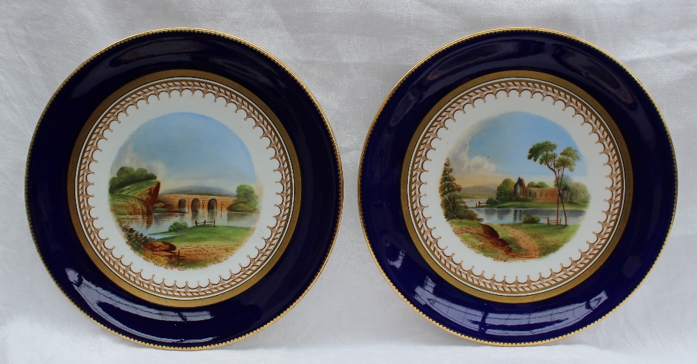 A 19th century porcelain dessert set each piece painted with landscape scenes within a Royal blue - Image 7 of 10