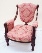 A Victorian mahogany library chair, the pad upholstered shield shaped back,