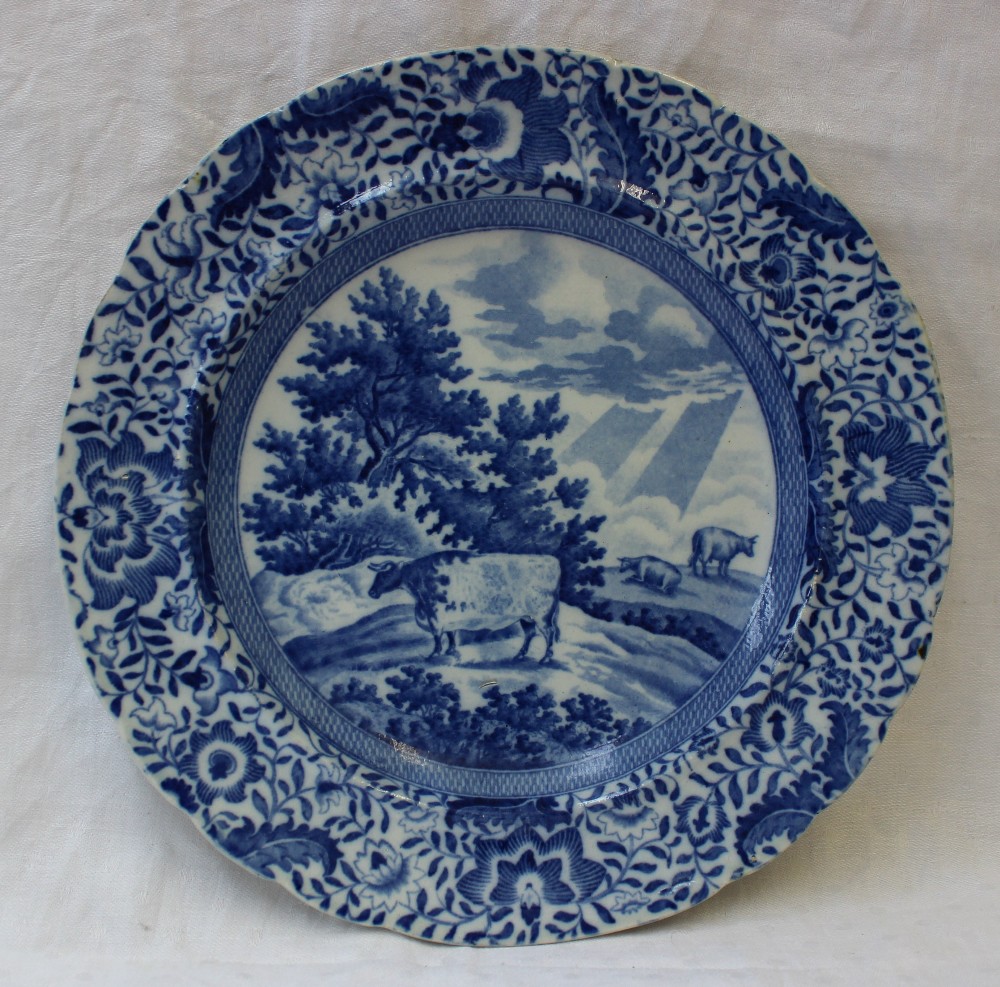 A 19th century blue and white pottery plate transfer decorated in the Durham Ox series pattern, with