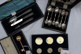 A William IV silver christening set, comprising a knife, fork and spoon, cast with shells,