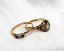 A Victorian diamond cluster ring set with eight old cut diamonds to an 18ct yellow gold setting and