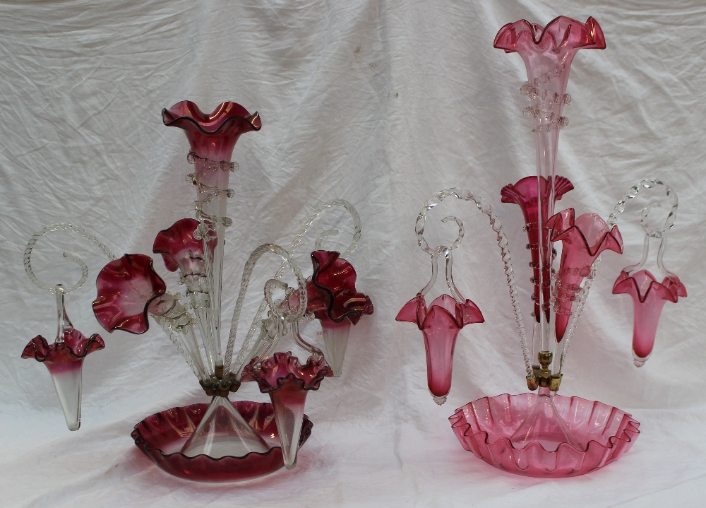A Victorian cranberry glass epergne, with a central trumpet, three flared trumpets, three twisted