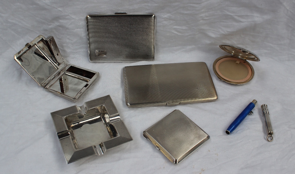 An Elizabeth II silver cigarette case of rectangular form, with engine turned decoration,