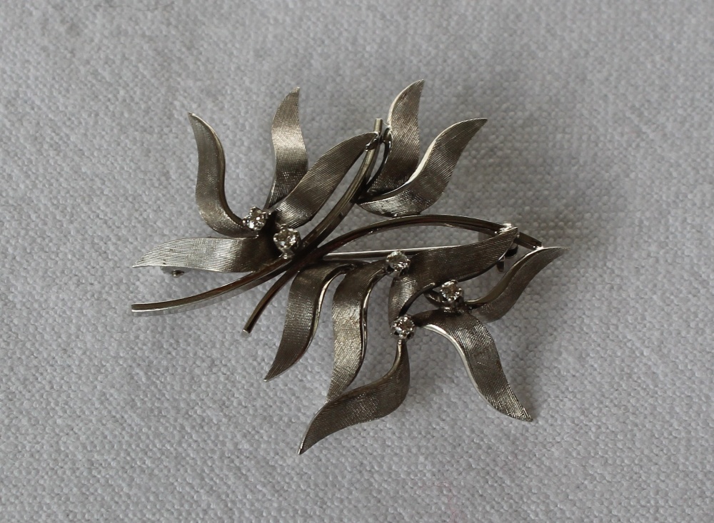 A 14ct white gold and diamond set brooch, with textured leaves set with five brilliant cut diamonds, - Image 2 of 3