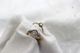 A diamond set dress ring of daisy form to a white metal setting and shank marked 18ct and plat,