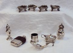 A set of four Victorian silver shell table salts, on dolphin feet, London,