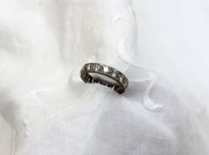A diamond eternity ring, set with sixteen round brilliant cut diamonds each approximately 0.05 of