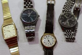 Three gentleman's Seiko wristwatches and another watch