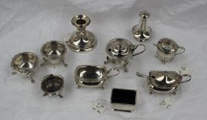 An Edwardian silver desk candlestick, Birmingham 1910, together with a collection of cruets,