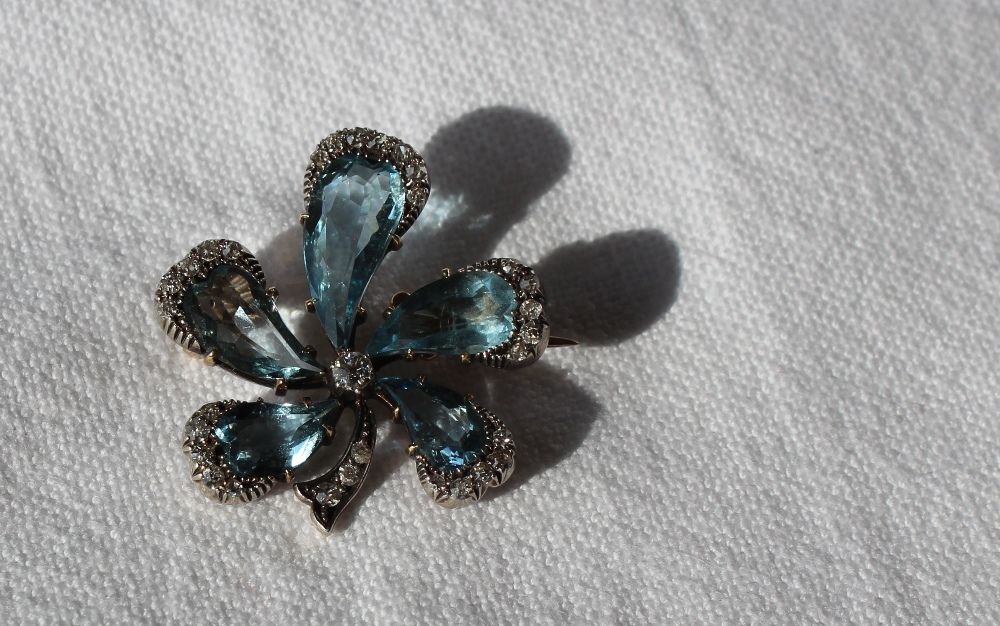 An aquamarine and diamond brooch of floral form with five tear drop shaped aquamarines, the centre - Image 3 of 4