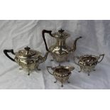 A George V silver four piece teaset, of oval shape, comprising a hot water jug, teapot,