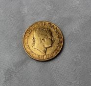 A George III gold sovereign,