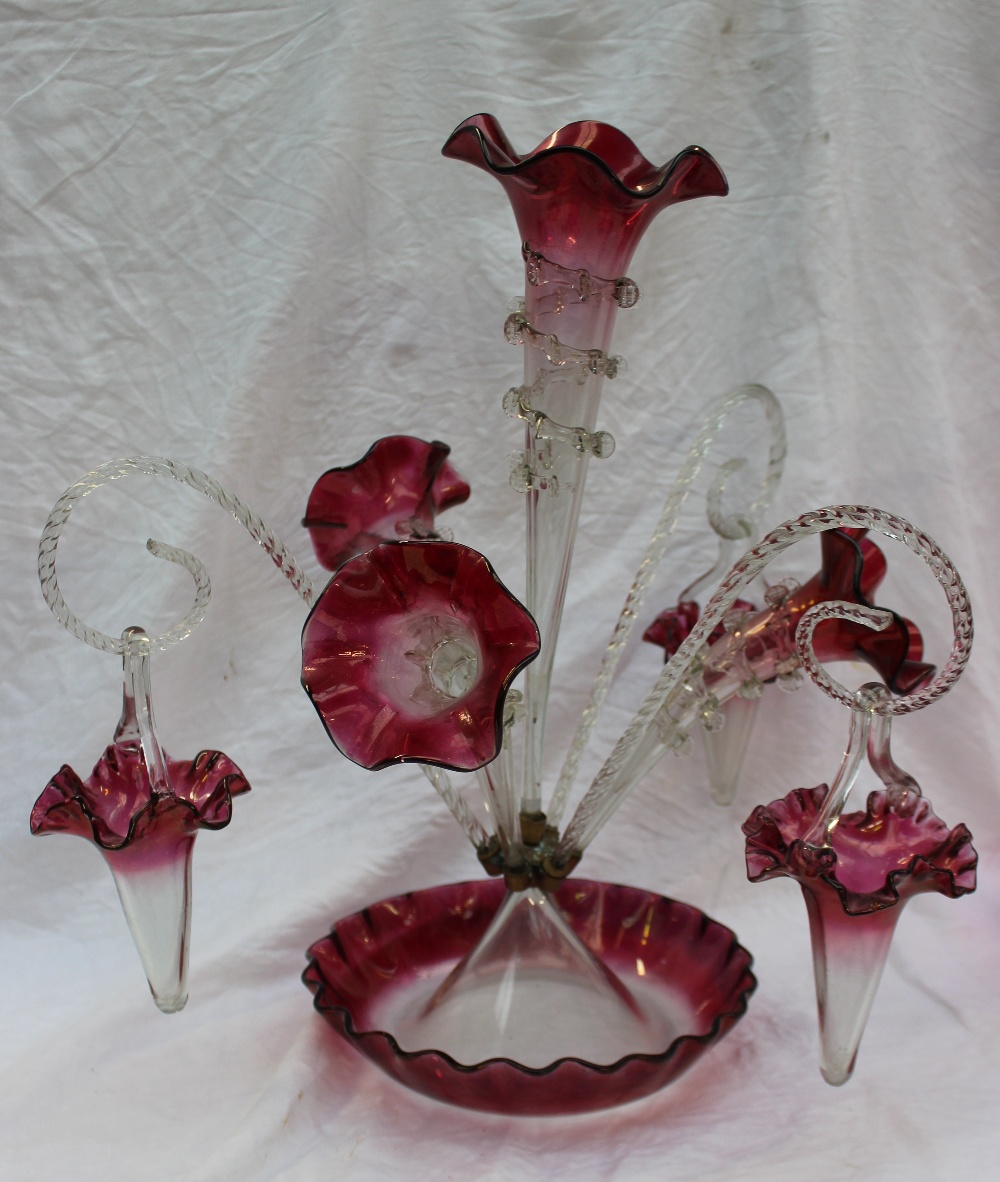 A Victorian cranberry glass epergne, with a central trumpet, three flared trumpets, three twisted - Image 2 of 3