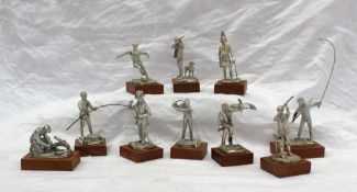 A set of ten silver model sportsmen on wooden bases depicting a fisherman, a footballer, a shooter,