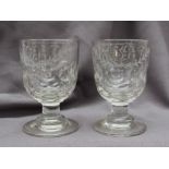 A pair of 19th century glass goblets engraved with initials and dimples on a cylindrical column and