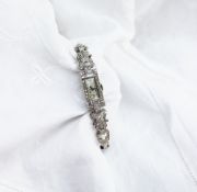 An Art Deco style diamond set cocktail watch set with baguette and old cut diamonds to a white