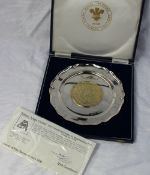 An Elizabeth II silver salver with a gilt metal centre produced by William Adams Limited to