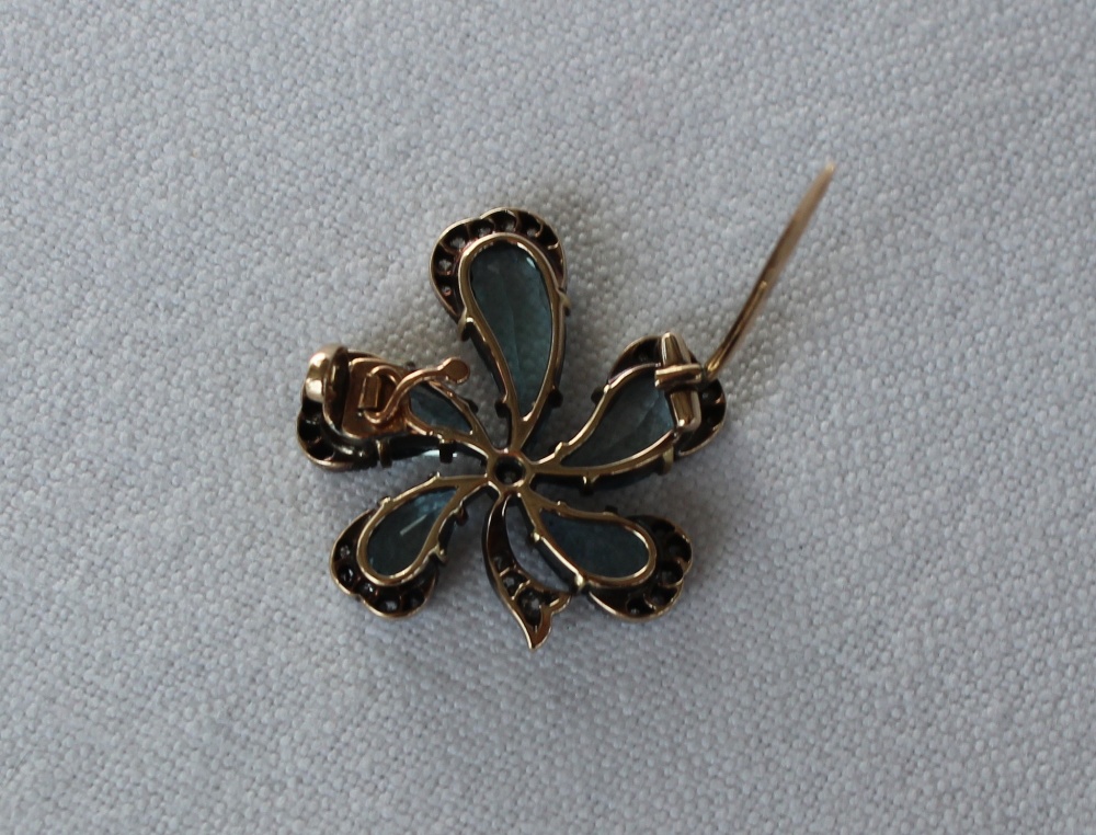 An aquamarine and diamond brooch of floral form with five tear drop shaped aquamarines, the centre - Image 4 of 4