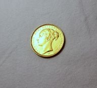 A Victorian gold sovereign, young head,