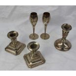 A pair of George V silver desk candlesticks, with square faceted base, Birmingham, 1933,