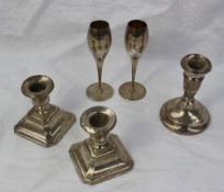A pair of George V silver desk candlesticks, with square faceted base, Birmingham, 1933,