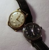 A war issue Omega wristwatch, the black dial with Arabic numerals and a seconds subsidiary dial
