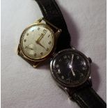 A war issue Omega wristwatch, the black dial with Arabic numerals and a seconds subsidiary dial
