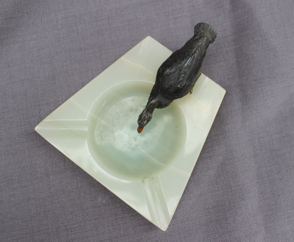 A cold painted spelter model of a drinking duck, standing on the edge of an onyx ashtray, - Image 3 of 4