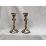 A pair of Elizabeth II silver candlesticks, with a tapering stem on a spreading foot, Birmingham,