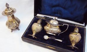 A white metal sugar caster with a flame finial and lobed body marked Black Starr & Frost Sterling,