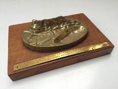 A brass model of the "Rock of Gibraltar" bears a plaque "Presented to Cardiff City A.F.C.