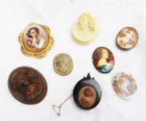 An ivory cameo brooch together with a shell cameo, three other cameos,