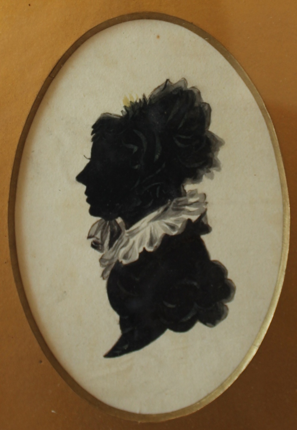 19th century British School
A silhouette of the head and shoulders of a lady
Watercolour
Oval
11 x