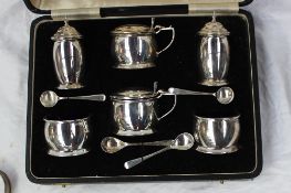 A George VI silver cruet, comprising two pepperettes, two mustard pots, two open table salts,