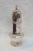 A Victorian silver sugar caster, the panelled pierced top above a baluster body on a spreading foot,