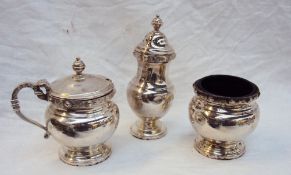 An Elizabeth II silver three piece cruet set, comprising an open salt, mustard pot and pepperette,