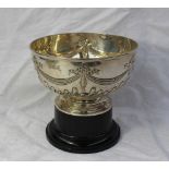 A late Victorian silver rose bowl, decorated with swags, bows and gadrooning, on a pedestal foot,