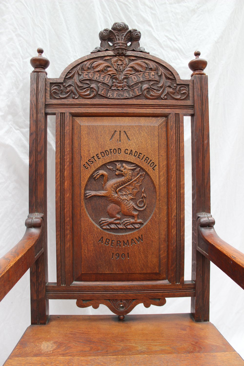 An early 20th century oak Eisteddfod Chair, carved with the Prince of Wales feathers to the top, the - Image 2 of 3