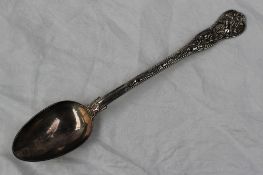 A George II silver Paul Storr silver serving spoon, cast in the Stag Hunt pattern, London, 1816,