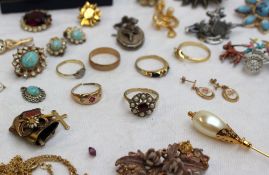 Assorted costume jewellery including a 9ct gold garnet and pearl dress ring, medallion, copper