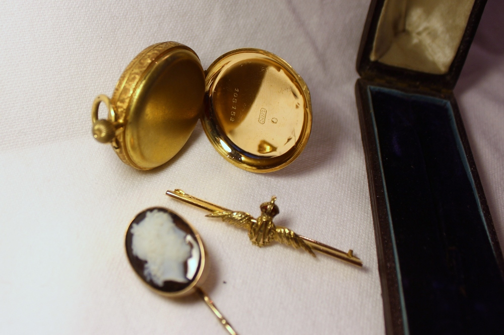 A hardstone cameo stick pin depicting a Romanesque figure head together with a yellow metal fob - Image 2 of 2