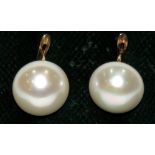 DORMILONAS de perlas cultivadas de botón de 12-12.5 mm. con montura en oro amarillo. Starting